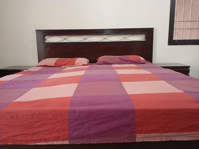 wooden bed, with mattress