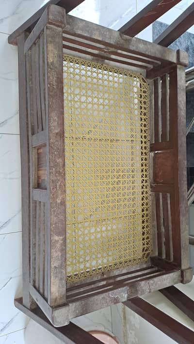 A traditional wooden baby cradle swing(jhoola or palna)