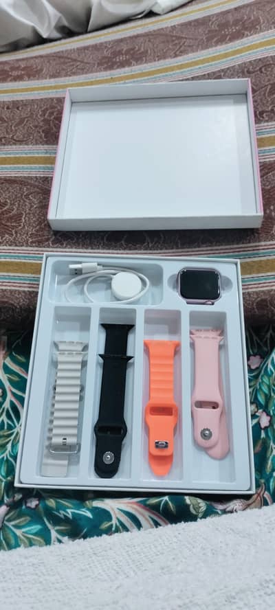 pink color watch with box and with charger
