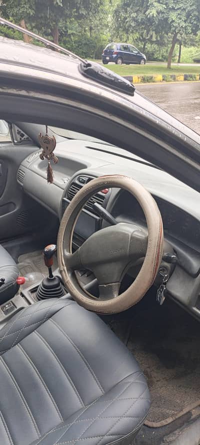 Suzuki Baleno 1999 model bht hi achi car hai chalny me zero meter