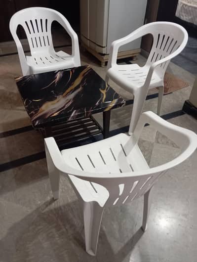 set of 3 plastic chairs with wooden table for sale