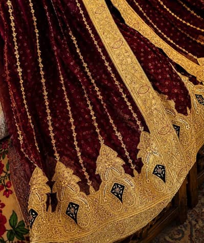 Maroon & golden heavy embroidered lehenga with matching dupatta