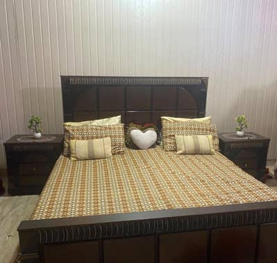 Double bed with 2 side tables and showcase