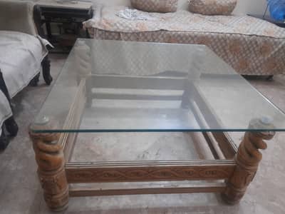 central table with glass and a coffee table