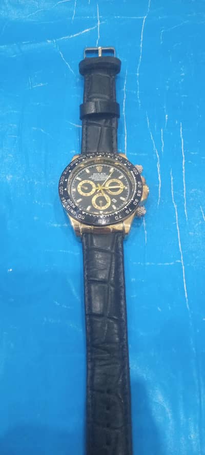 black and golden watch with pure leader straps