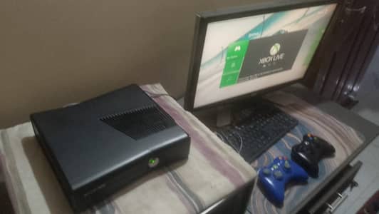 Xbox 360 slim, 250 gb hardrive, 1 wireless and 1 wired controller