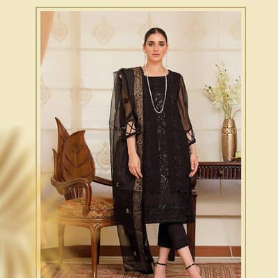 Three piece stitch dress with golden block printed organza dupatta.