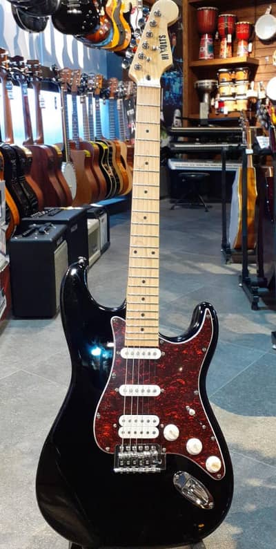 Stratocaster-Style electric guitar in gloss black with a striking red