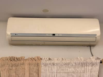 LG 1.5 TON AIR CONDITIONER