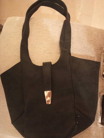 black leather medium sized shoulder bag