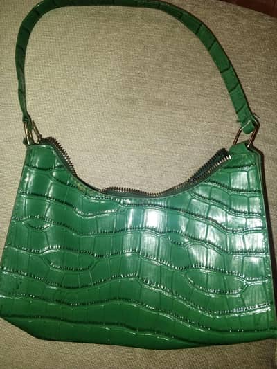green leather bag