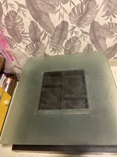 Square shaped dining table with tempered glass
