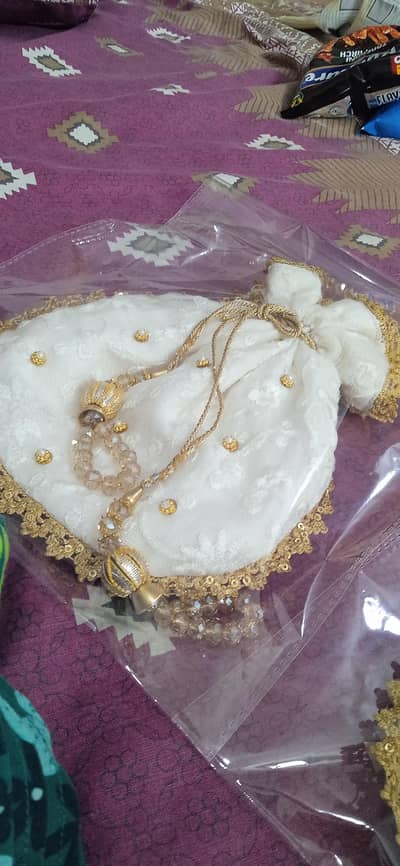 white net potli bag with sitara work