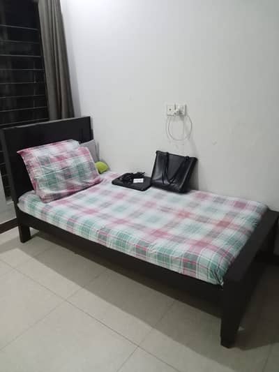 single wooden bed 1 year old