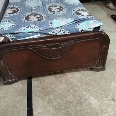 wooden single bed