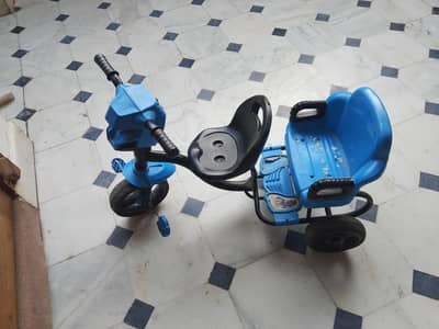 Blue double seated tricycle