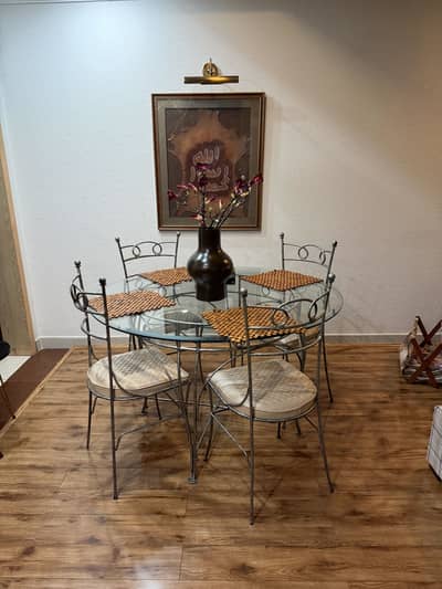 Breakfast rod iron table 4 chairs and centre glass table for sale