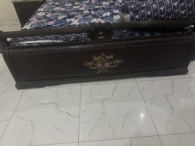 wooden bed and dressing