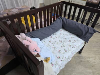 dark brown baby cot