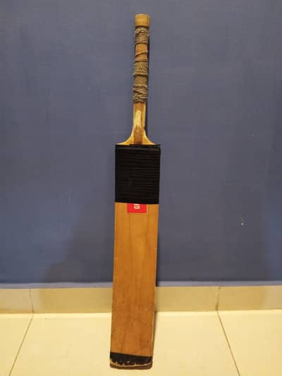 gray-nikals bat and grip and one hard ball