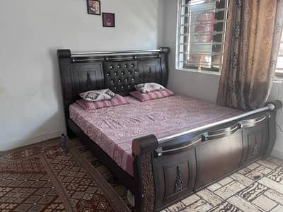 double bed with side table and dressing