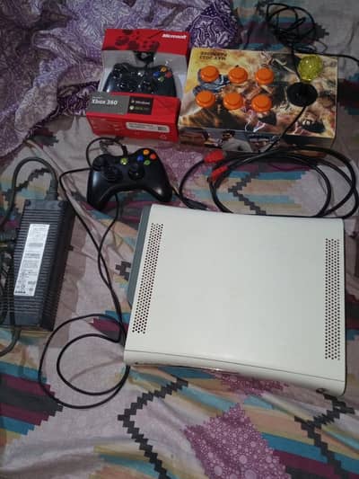 Xbox 360 with two controllers and arcade stick
