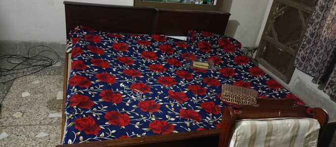 2 single wooden beds