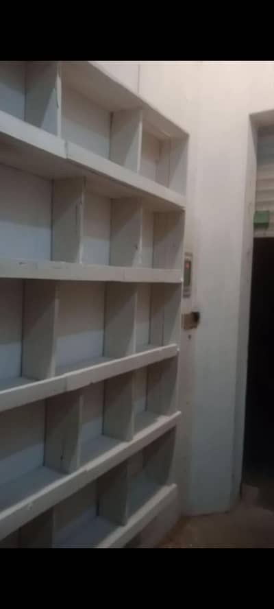 shop racks pure kachi lakri k bany hoey Hain or mobile counter b sath