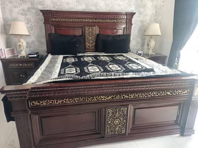 1 king-sized bed high glossed with two side tables. Without mattress