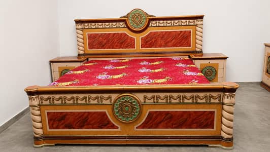 Traditional wooden bed and dressing table.