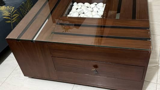 3 wooden 3 center tables with glass top and a pair of puffy stools
