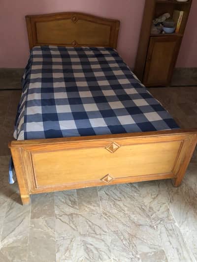 Single wooden bed with mattress