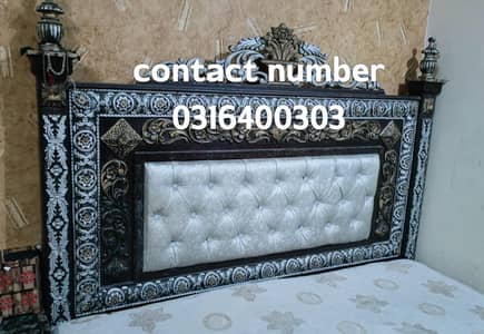 Double bed king size with dressing and side tables.