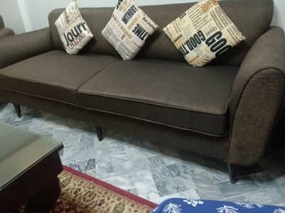 Selling New condition 5 seater Sofa with Table