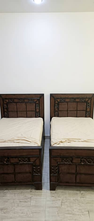 Two single bed with mattresses for sale