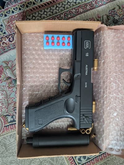 toy shell dispenser gun for kids
