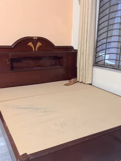 Double wooden bed with attached draws