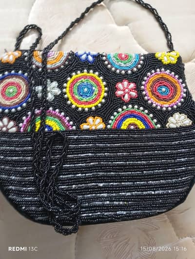 two purses in mint condition embroidered