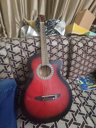 red color wooden guitar