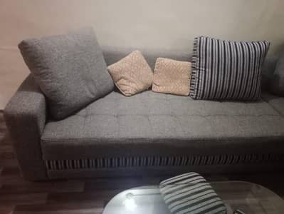 7 seater Lshaped sofas with table and 4stools