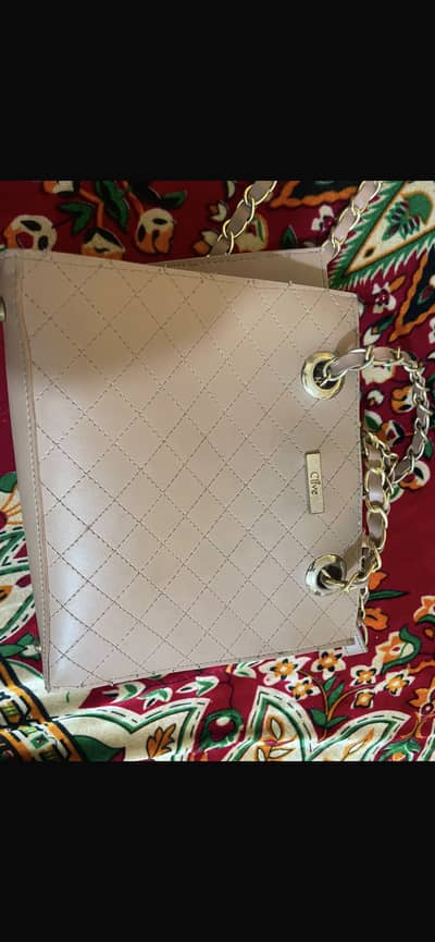 Clive Brand Nude Quilted Sling Bag with Chain Strap