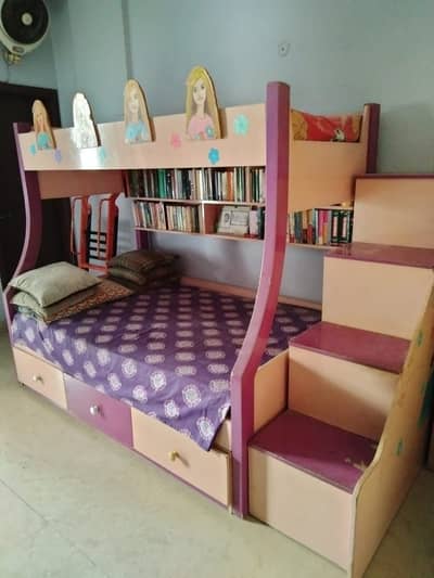 Bunk bed with bookcase, drawers and cabinets