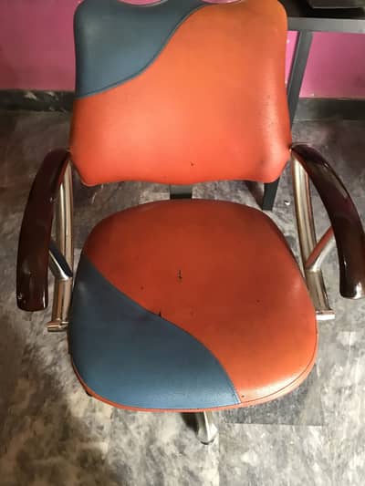 Salon chair , orange color , steel