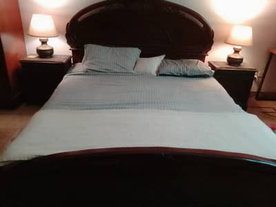 Urgent Double bed with side tables and dresser for sale.