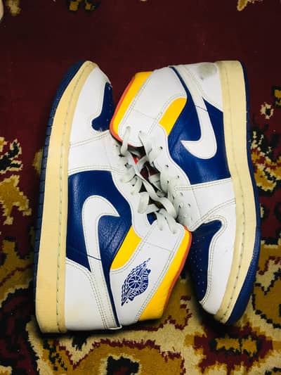 branded shoes and thrift pair