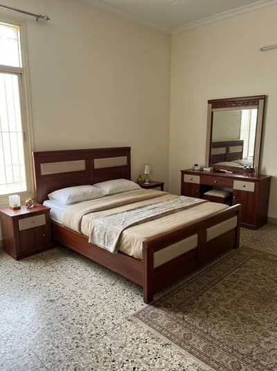 bed with sidetables and dressing