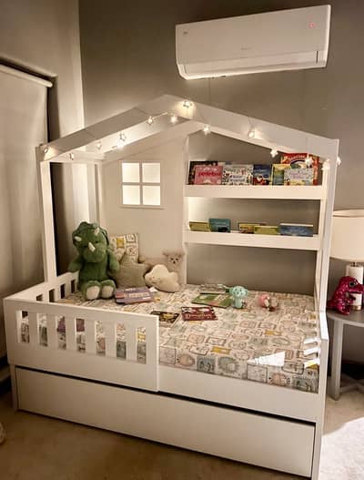 Trundle kids bed with a book shelf