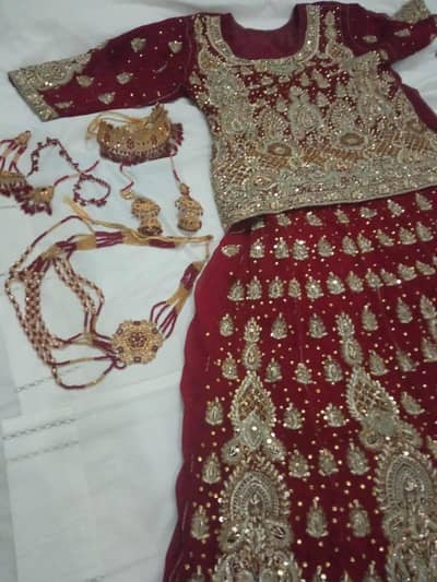 Bueatiful red bridal lehnga with jewellery