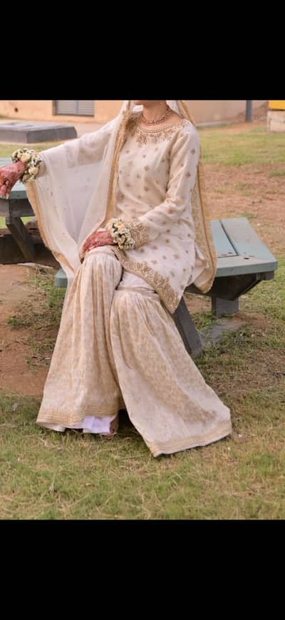 White and golden nikkah outfit