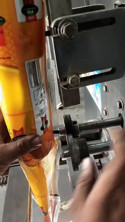 packing machine with red chilli and haldi wrapper